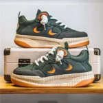 Basket verte avec semelle blanche et détails orange